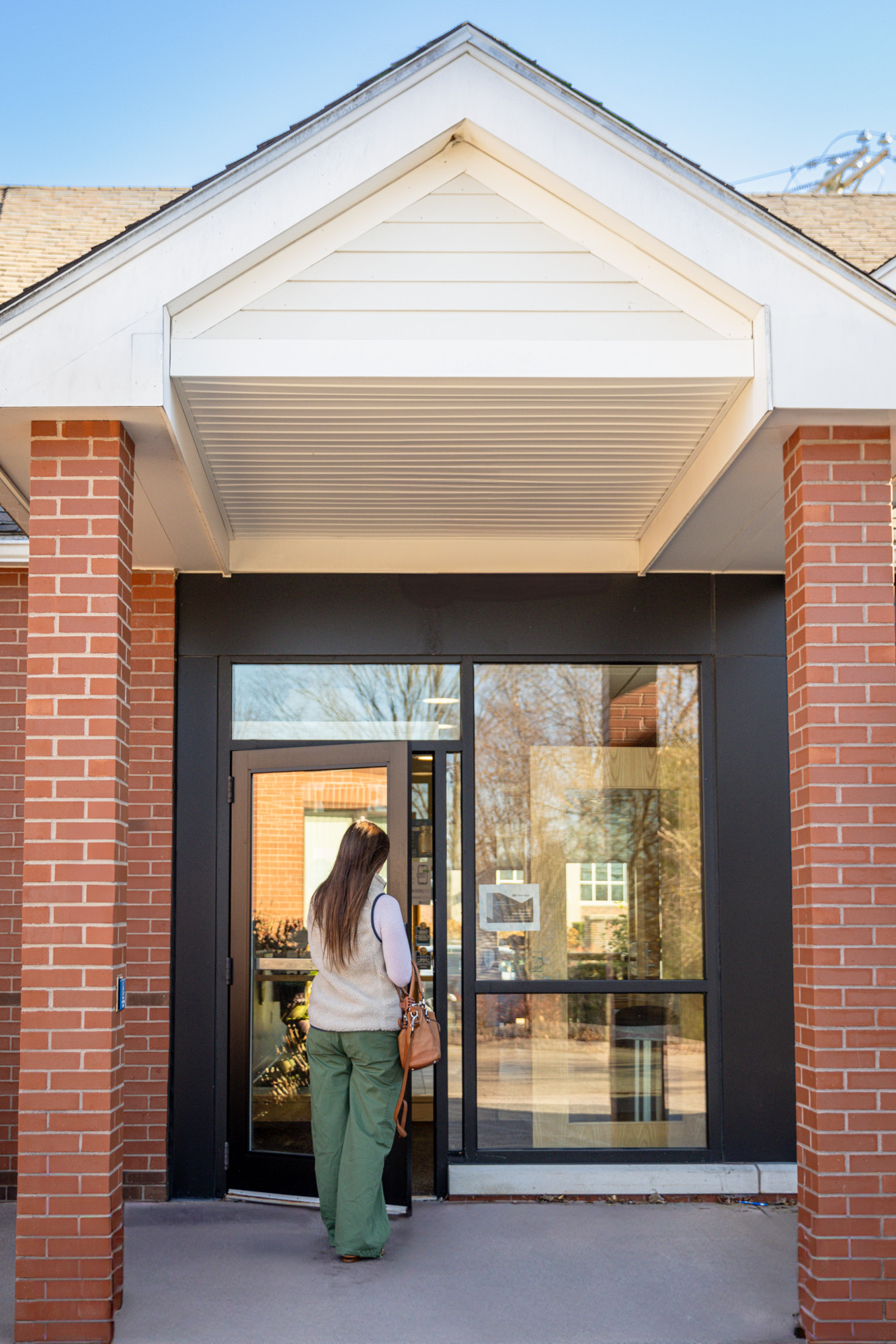 Patient entering the dermatology & skin health building
