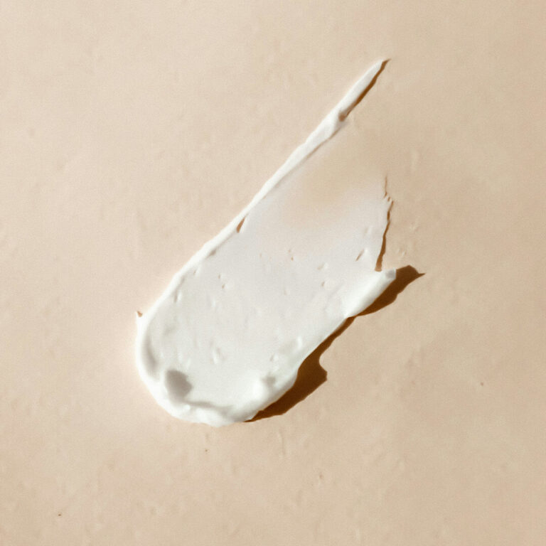 Face cream on plain surface