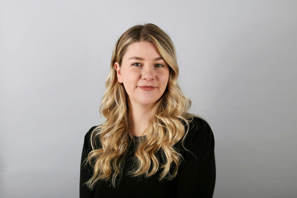 Woman softly smiling in headshot
