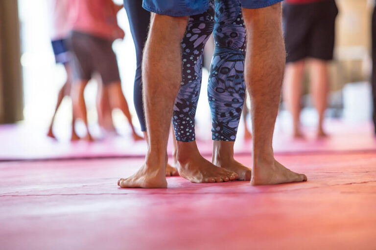 Feet standing on gym floor