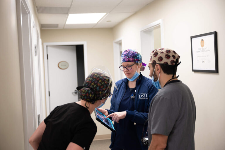 Dr mendese working with medical assistants