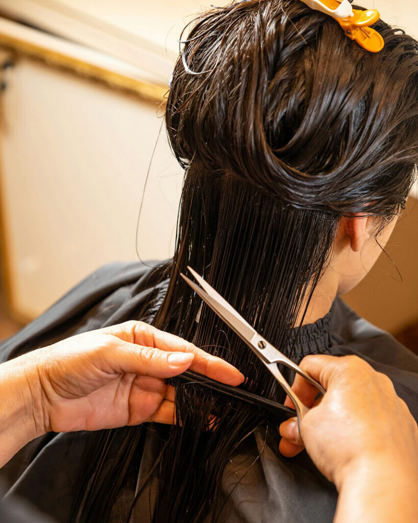 Person getting their hair cut